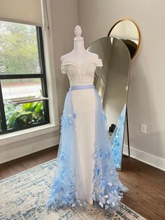 Enhance your wedding day look with our exquisite Blue Detachable Wedding Train, adorned with elegant 3D flowers. This unique, eye-catching accessory transforms any wedding gown into a breathtaking masterpiece, adding a touch of sophistication and glamour. Crafted with meticulous attention to detail, the vibrant blue fabric provides a stunning contrast, while the lifelike 3D flowers create a mesmerizing effect, ensuring you make a memorable entrance. Perfect for brides seeking a versatile, statement-making piece, our detachable train offers the flexibility to switch up your look from ceremony to reception effortlessly. Make your special day unforgettable with this one-of-a-kind, luxurious wedding train. Fitted Blue Tulle Wedding Dress, Blue Tulle Wedding Gown, Blue Wedding Gown With Tulle Skirt, Bridal Overskirt, Dress Ideas Summer, Wedding Train, Bridal Skirt, Vowel Renewal, Unique Wedding Dress