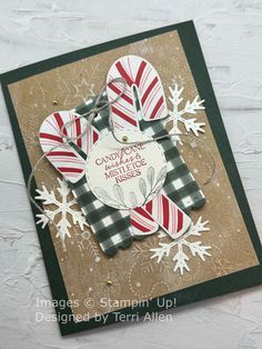 a handmade christmas card with snowflakes and candy canes