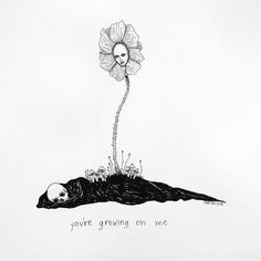 a black and white drawing of a person laying on the ground with a flower growing out of their head