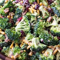 broccoli salad with cheese and cranberries in a bowl