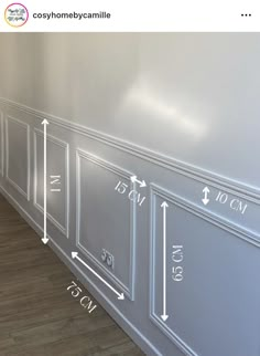 an image of a room with measurements on the wall and flooring in front of it