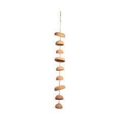 a wind chime made out of wooden discs