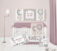 a baby crib bedding set with pink and white decor