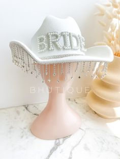 the bridal hat is adorned with crystal beads