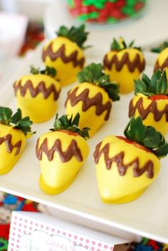 chocolate covered strawberries are arranged on a plate