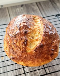 a loaf of bread sitting on top of a cooling rack