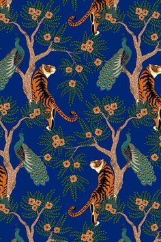 a tiger and peacock sitting on top of trees