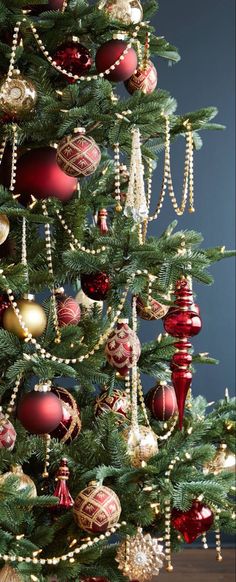 a christmas tree with red and gold ornaments