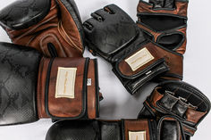 five pairs of black and brown boxing gloves