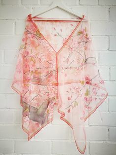 Luxury Hand painted Silk Chiffon scarf with flowering Cherry Tree branch in Warm Pink background. Lots of white and light pink cherry blossoms and little dark pink buds flowering in a spring time. Several olive green leaves and wind blown petals... Some accents in gold. All this beauty is framed with and double olive green and darker pink boarding. Very romantic, sweet, soft and cozy. ---------------------------------------------------------------------------------------------------------------- Pink Bohemian Shawl For Spring, Pink Shawl Scarf For Spring, Pink Shawl Scarves For Spring, Pink Floral Print Shawl Scarf, Spring Floral Print Pink Dupatta, Pink Silk Shawl For Spring, Summer Pink Floral Print Dupatta, Pink Feminine Floral Print Scarves, Pink Floral Print Feminine Scarves