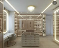 a large walk in closet with lots of drawers and lights on the ceiling above it