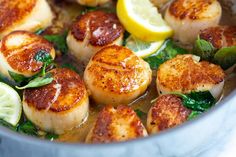 scallops with lemon and spinach in a pot