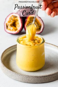 a spoon with some food in it on a plate and the words passion fruit curd