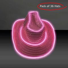 a pink light up hat sitting on top of a table