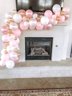 a fireplace decorated with balloons and a television