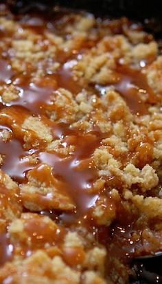 a close up of food in a pan with gravy and sauce on it