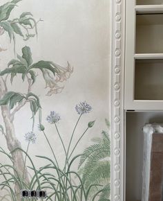 the wallpaper is decorated with flowers and plants