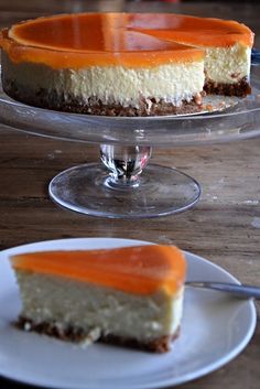 a slice of cheesecake on a white plate with an orange topping and a fork