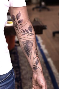 a man with a tattoo on his arm