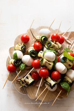 several skewers of vegetables on wooden sticks