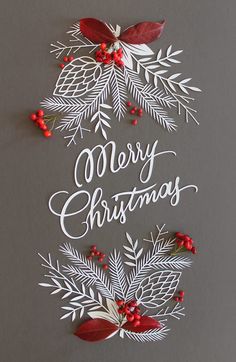 the words merry christmas are cut out from paper