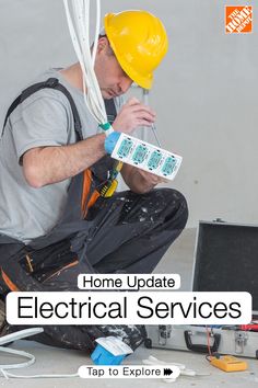 a man sitting on the ground working with electrical wires in front of his head and hands