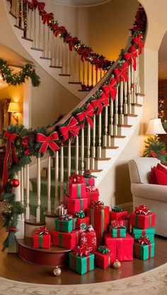 christmas presents under the banister in front of a staircase decorated with red and green bows