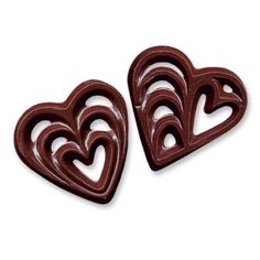 two heart shaped chocolates sitting on top of each other