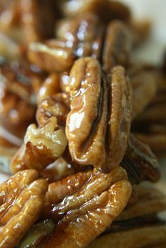 several pieces of pecans are stacked on top of each other with caramel drizzle