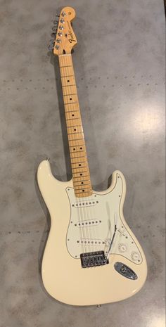 an electric guitar sitting on top of a table