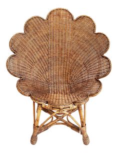 a chair made out of wicker with a flower design on the back