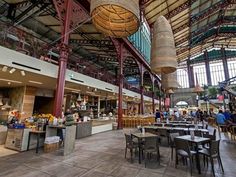 the inside of a restaurant with tables and chairs