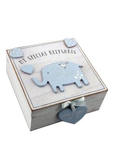 a wooden box with an elephant on it