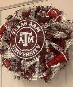 a wreath with the texas a & m university logo on it