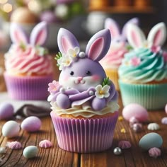 some cupcakes with bunny ears and flowers on them