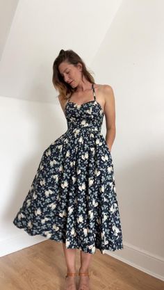 Feel feminine in this vintage Laura Ashley 80s cotton floral midi summer dress, a rare and collectible piece perfect for any vintage fashion enthusiast. This super feminine dress features: Adjustable Shoulder Straps: Customize the fit to your liking for maximum comfort. Fitted Top & Wide Skirt: Flattering design that accentuates the waist and flows beautifully. Dark Blue with White Roses: Classic and elegant color combination, perfect for summer. Zipper at the Back: Easy to put on and take off, Laura Ashley 1980s, Laura Ashley 80s, Midi Summer Dress, Wide Skirt, Vintage Laura Ashley, Fashion Enthusiast, Elegant Color, Midi Dress Summer, Fitted Top