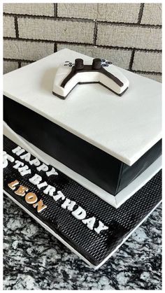 a birthday cake with a cross on top