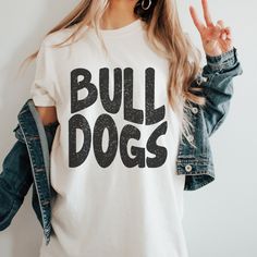 Here's a tee made just for you and your team spirit! This distressed BULLDOGS Mascot tee is super soft and comfy. Shown on a super soft comfort colors ivory tee, but so many colors to choose from. Design made on unisex comfort colors shirt. Bulldogs Spirit Shirt, Circuit Crafts, Teacher Clothes, Distressed Shirt, Spirit Shirts