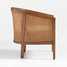 a wooden chair with wicker back and armrests on the side, against a white background