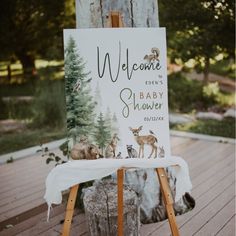 a welcome sign for a baby shower with deer