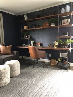 a living room filled with furniture and a book shelf on top of a wooden table