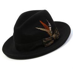 Unveil a new level of elegance with our Black/Khaki with Matching Grossgrain Ribbon 2 1/2" Wool Felt Fedora Hat from the Spectara Collection. This impeccably designed hat is crafted from top-tier wool, promising both comfort and long-lasting wear. Its bold black shade provides a versatile foundation, while the feather accent offers a splash of vibrant color. Wrapped with a textured ribbon that adds an extra layer of sophistication, this hat is a quintessential piece for any fashion-forward wardrobe.   Features:    Pinch crown design  Chic feather accent  Solid Color    Built-in sweatband   Made from 100% wool  2.5" brim   Grosgrain ribbon   No lining for lightweight comfort   Size XL available for an additional $5     H2477- Black/Khaki Swag Hats, Happy Hat, Hat Size Chart, Felt Fedora, Crown Design, Black Shade, Timeless Accessories, Black Khakis, Fedora Hat