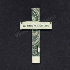 a dollar bill cross with the words fix god we trust