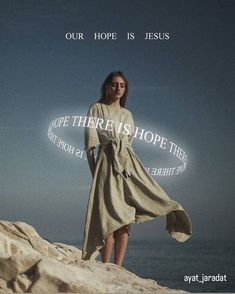 a woman standing on top of a rock next to the ocean with words above her