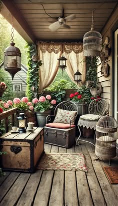 an old suitcase is sitting on the porch with flowers and plants around it, next to a wicker chair