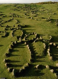 an aerial view of stonehenge in the grass