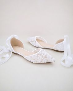 Crochet lace pointy toe flats for comfortable wear throughout your special day and perfect for wedding party. We've added satin or sheer organza lace up ribbon to make this a ballerina shoe. DETAILS: UPPER: Synthetic upper and lining MATERIALS: Manmade outsole HEEL HEIGHT: 0.3" ORIGIN: Imported Elegant Lace-up Party Flats, Lace-up Lace Wedding Shoes For Formal Occasions, Formal Lace Wedding Shoes With Lace-up Design, Fitted Lace-up Lace Wedding Shoes, Formal Lace-up Lace Wedding Shoes, Spring Wedding Lace Shoes, Lace Flat Heel Wedding Shoes, Lace-up Bridesmaid Wedding Shoes, Spring Wedding Lace-up Shoes