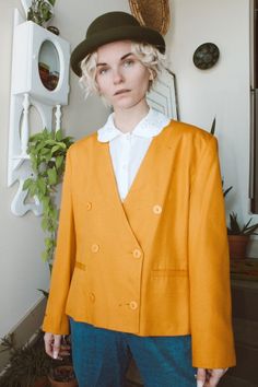 "This mustard yellow double breasted blazer is quite possibly the perfect springtime blazer! The color is vivid and the fit is fabulous! Size marked: 12 Measurements- Shoulder to shoulder: 18\" Chest: 42\" Length: 23\" All sales are final! Our items are VINTAGE, meaning they have a 15+year history, a story! Due to the previous wear and passage of time, they may have resulting flaws or imperfections. If you have any questions or need more information and/or photos of items, feel free to reach out Retro Lapel Collar Blazer For Spring, Retro Spring Blazer With Lapel Collar, Retro Blazer With Lapel Collar For Spring, Retro Notch Lapel Blazer For Spring, Yellow Notch Lapel Blazer For Fall, Fitted Yellow Blazer For Spring, Yellow Notch Lapel Outerwear For Fall, Vintage Tailored Blazer For Spring, Classic Orange Outerwear For Spring