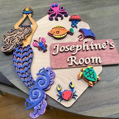 a wooden sign that says, josephine's room with sea creatures on it