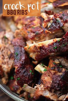 a close up of meat on a plate with the words crock pot bbq ribs